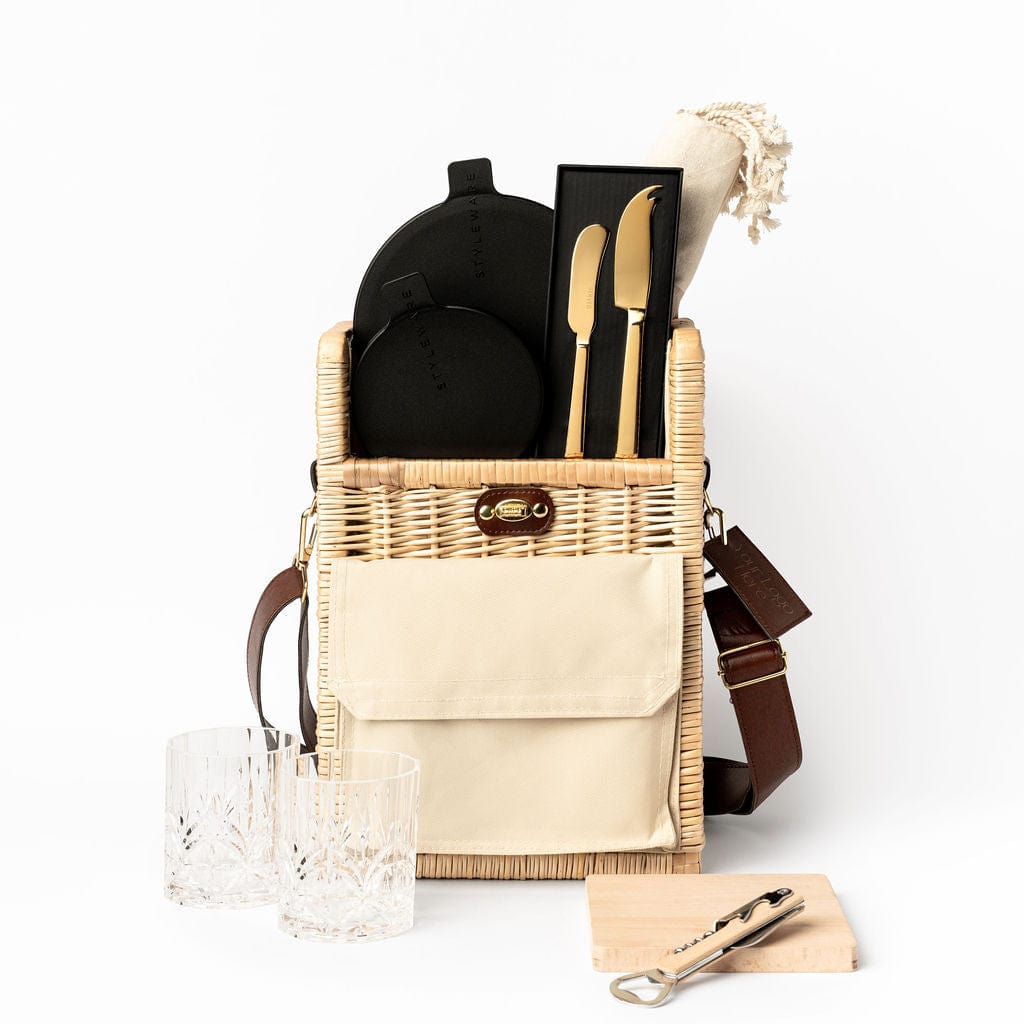 The Long Lunch Portable Wicker Picnic Basket Gift by Ellar Boutique. Featuring Styleware nesting bowls, Served cheese and pate knife set, turkish hand towel in beige, acrylic etched tumbler set, beech wooden serving board and bottle opener.