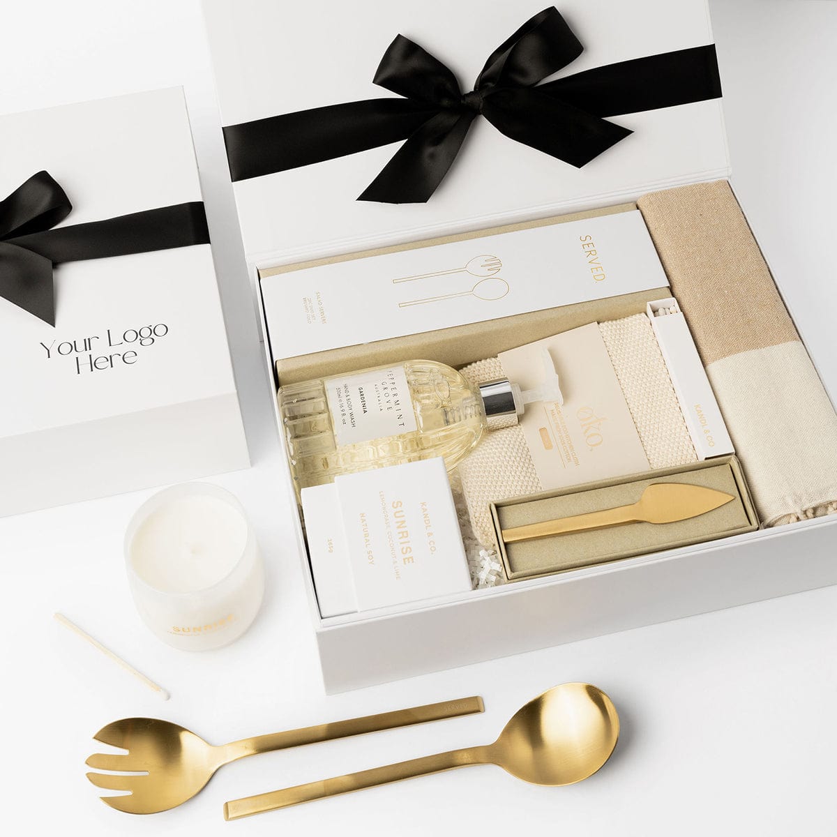 A selection of white, beige and brushed gold homewares makes up this Settlement Gift. 